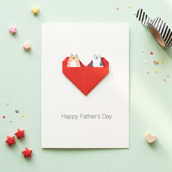 Personalised pet fathers day card displayed open showing pocket compartment with two cat cut outs inside peeping out. 