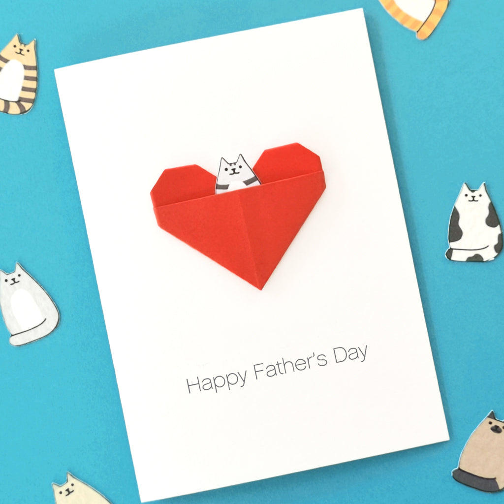 Handmade personalised cat dad card with elegant folded origami heart attached to white premium cardstock 