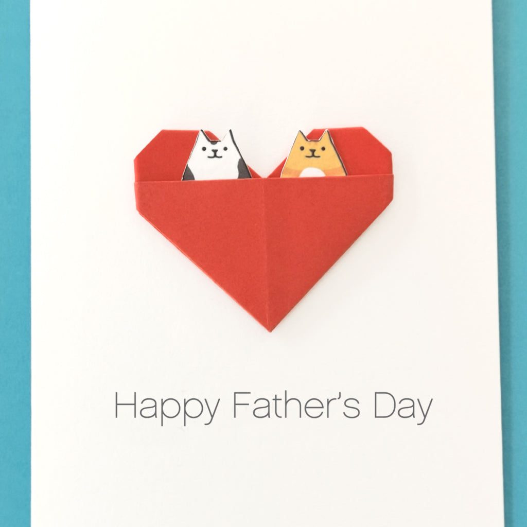 Father's Day card with two kawaii cats in a red heart on a white background